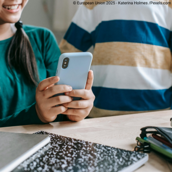 student holding phone